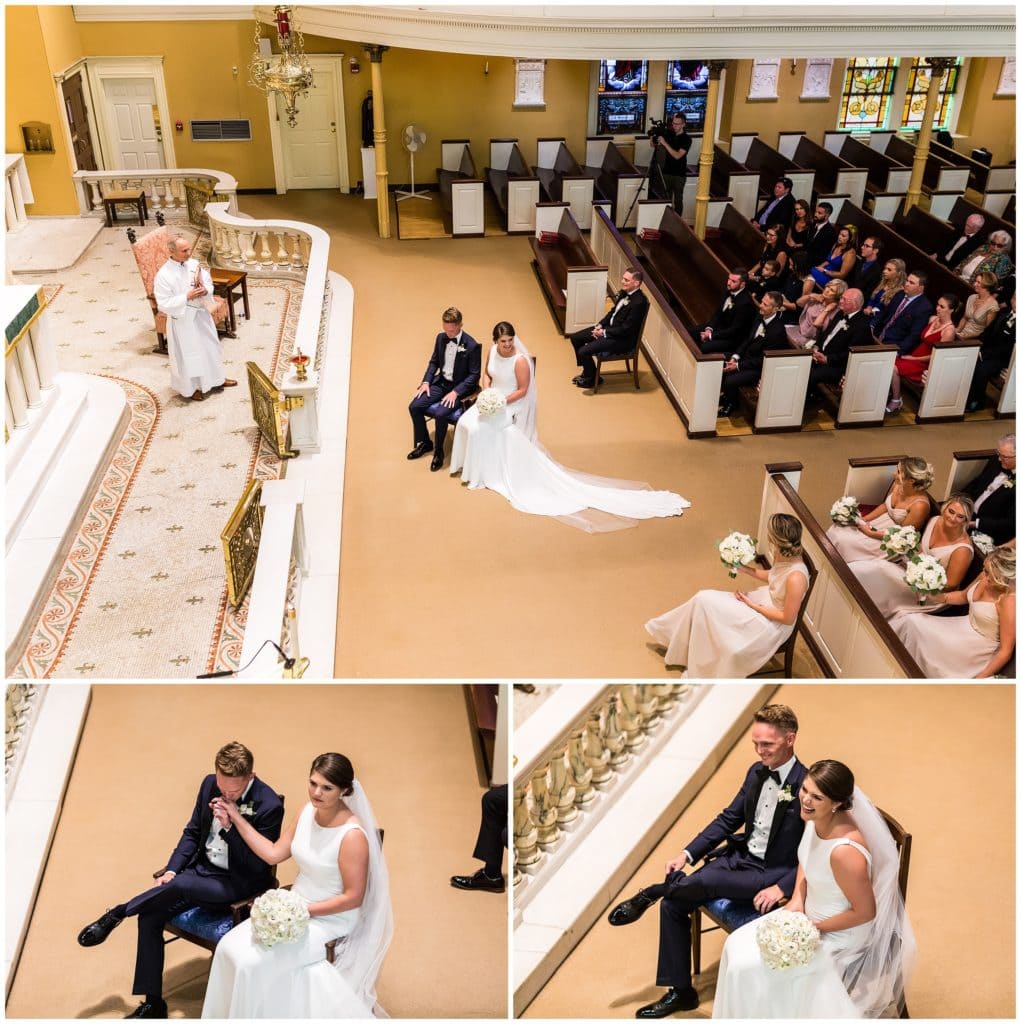 Traditional Catholic Church wedding ceremony with groom kissing bride on the hand during readings