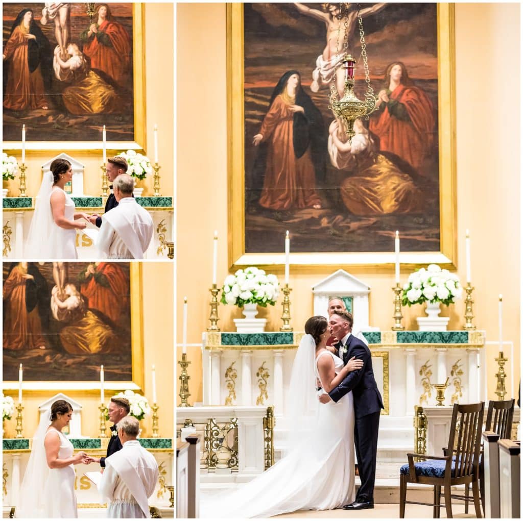 Bride and groom exchanging rings and kissing in traditional Catholic Church wedding ceremony