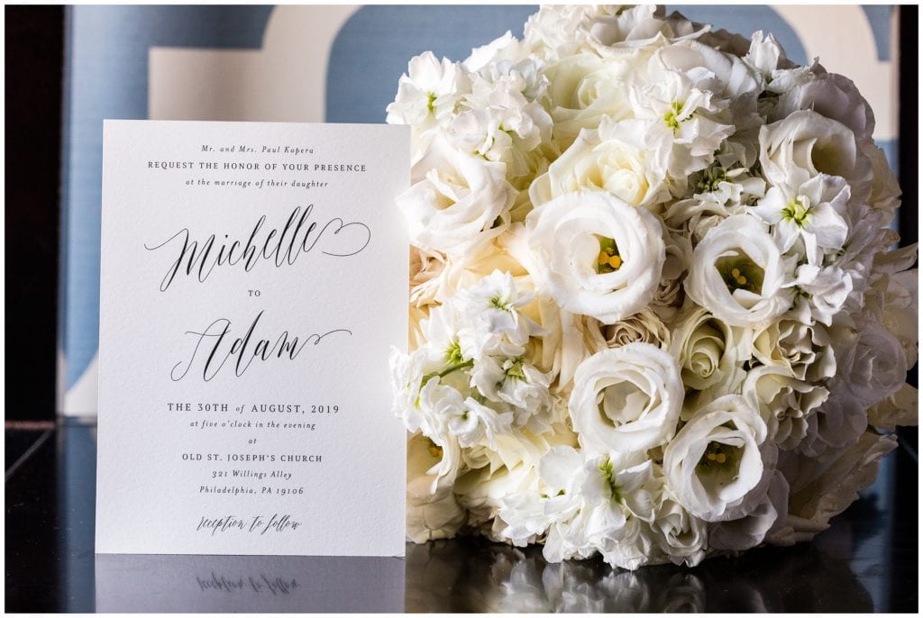 Wedding invitation with simple white bridal bouquet