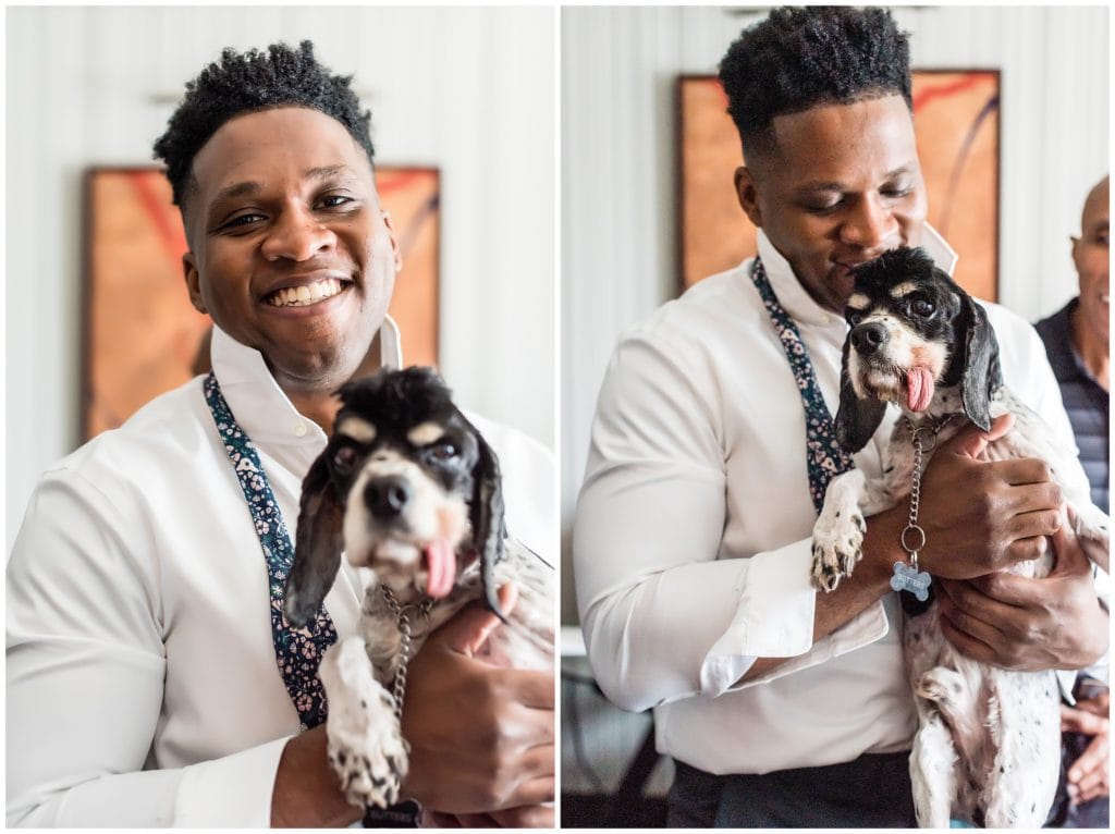 Window lit groom portrait with puppy