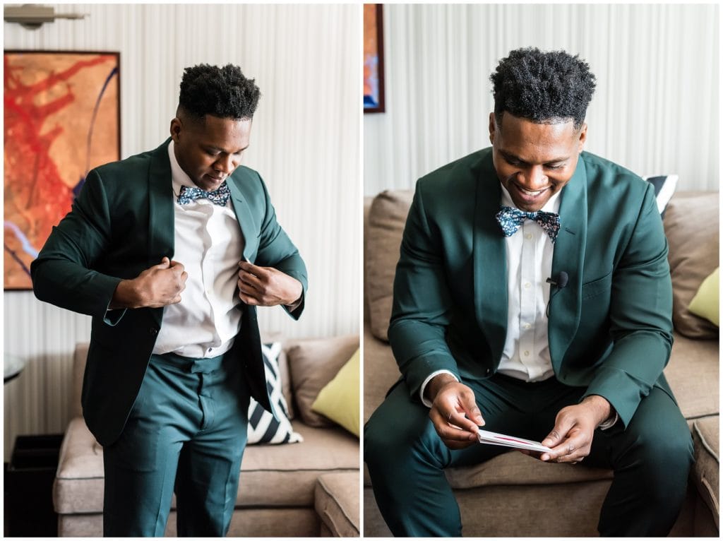 Groom putting on green tuxedo jacket and reading letter from his bride