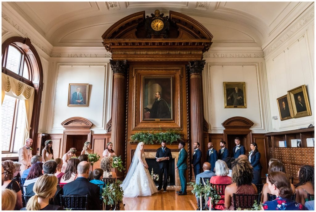 Indoor wedding ceremony in library at College of Physicians