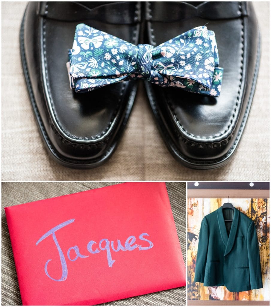 Groom wedding details with floral bowtie, green tuxedo jacket, and handwritten letter from bride