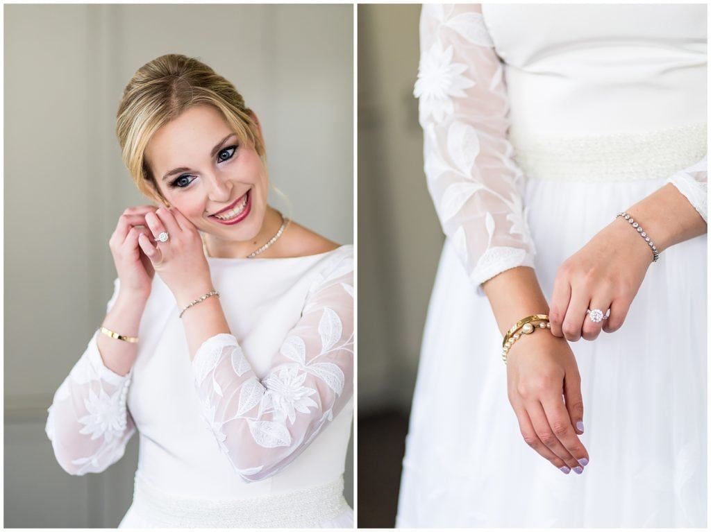 Bride putting on her earrings and bracelets with her mother's vintage wedding gown