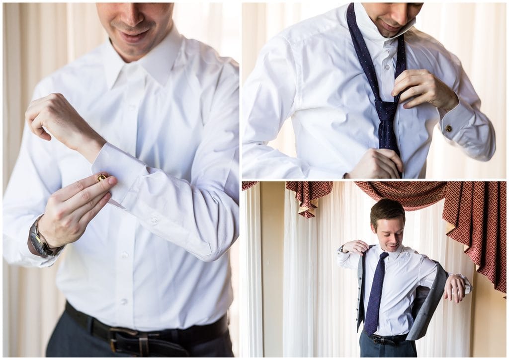 Groom putting on cufflinks, tying tie, and putting on vest before wedding