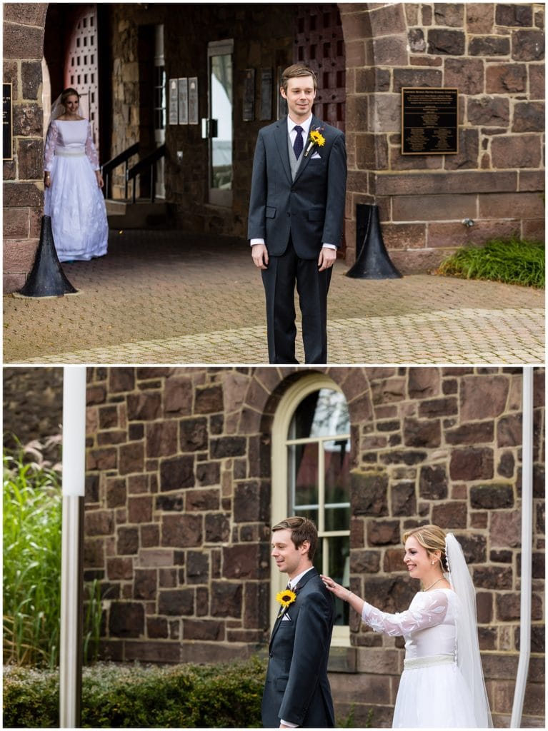 Groom waiting for bride behind him and tapping him on the shoulder during first look at Michener Museum wedding