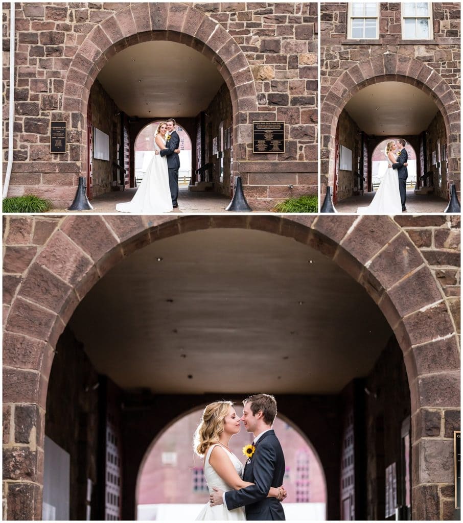 Bride and groom portraits in front of brick tunnel at the Michener Museum