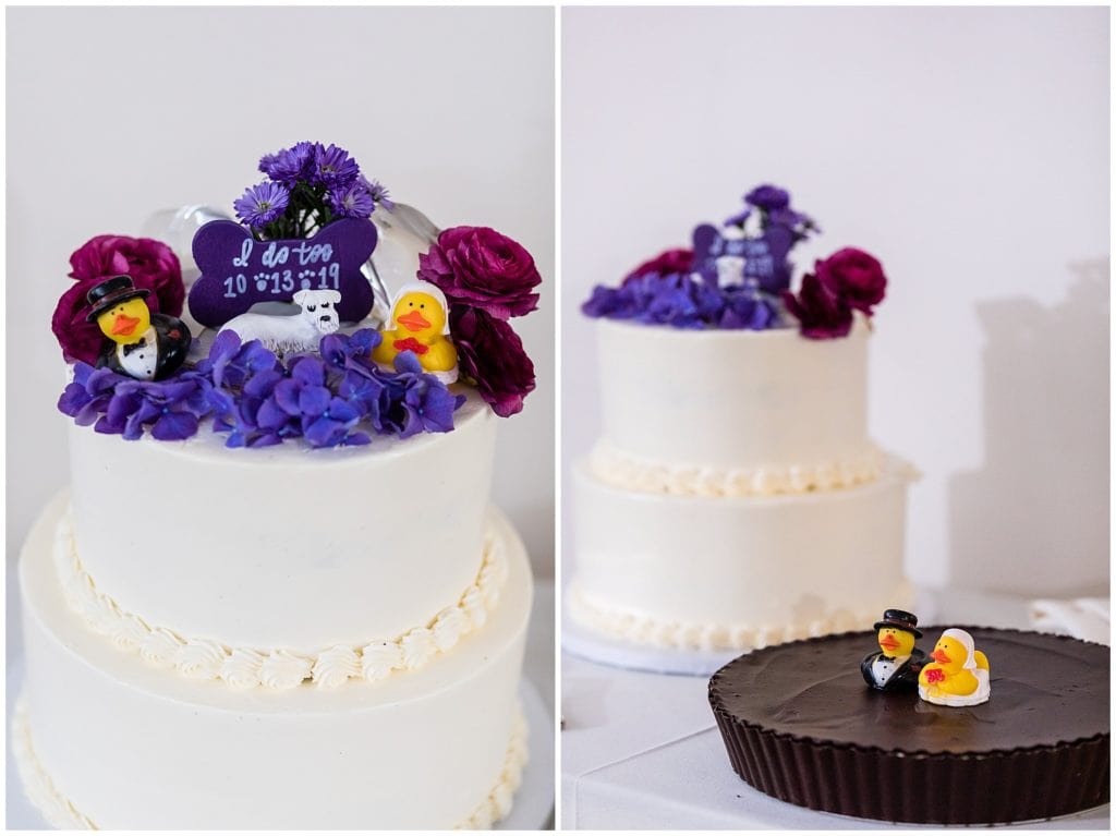 Wedding cake with purple florals, dog bone and dog, and bride and groom rubber ducks