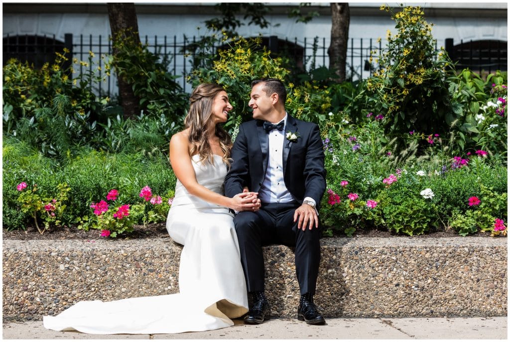 Bride and groom city and laughing portrait at Philadelphia City Hall