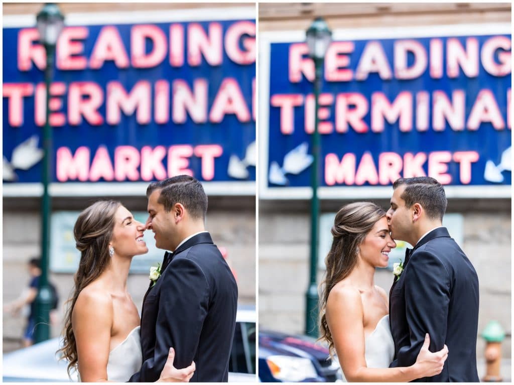 Bride and groom laughing and kissing outside of Reading Terminal Market