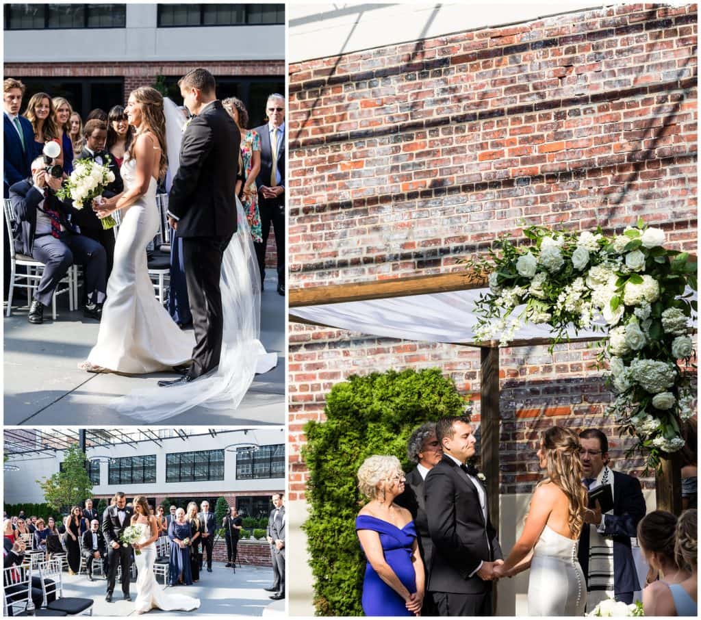 Vie courtyard Jewish wedding ceremony under chuppah with white florals and greens