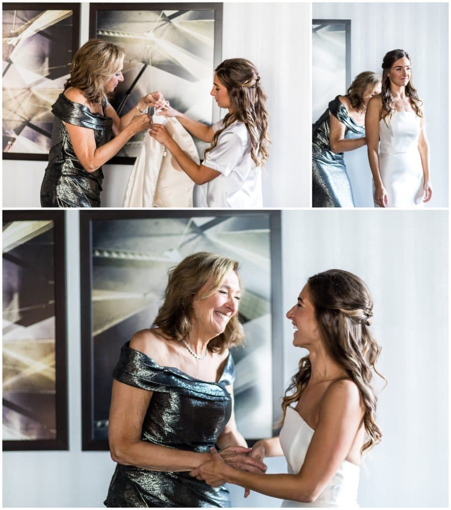 Mother of the bride helping bride into her gown, getting ready at the Notary Hotel