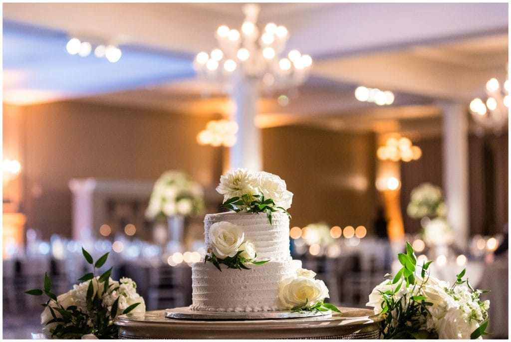 Simple small wedding cake with white florals at Vie wedding reception