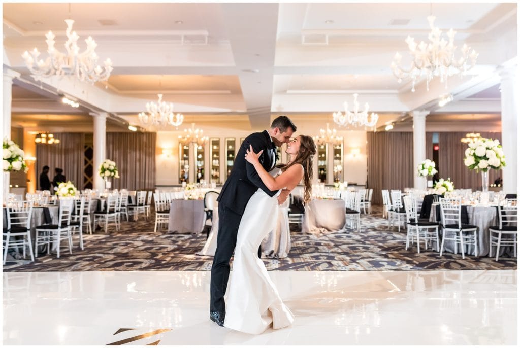 Bride and groom dance and dip alone in Vie reception space