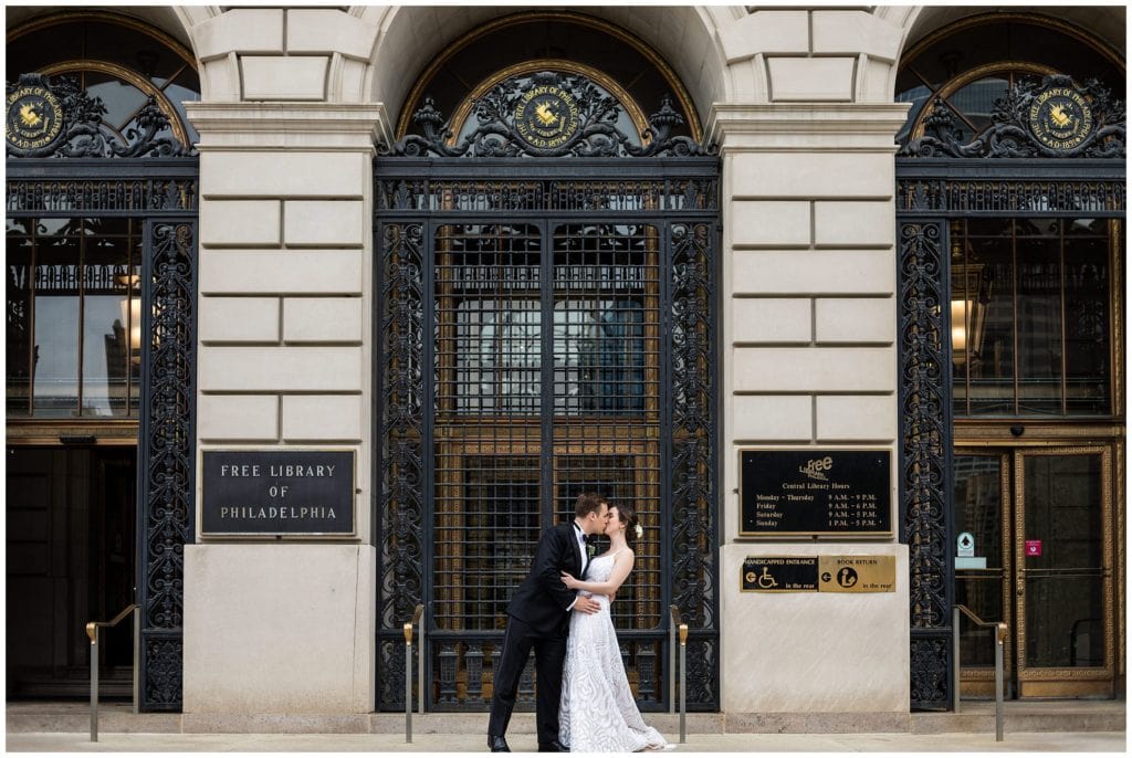 portrait of bride and groom outside Free Library at Philadelphia - best Philadelphia Wedding Venues