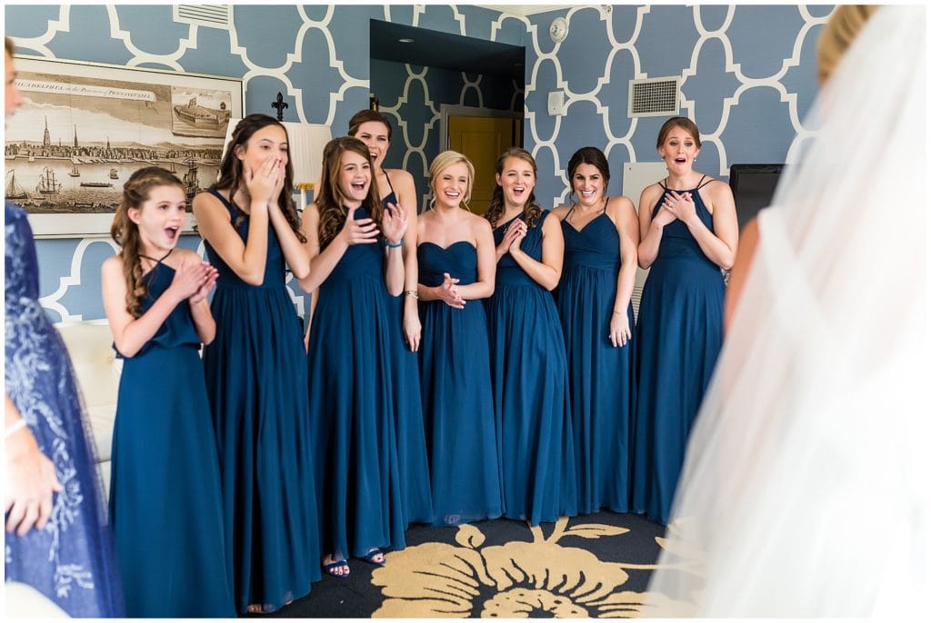 Bridesmaid reveal of bride in her wedding gown