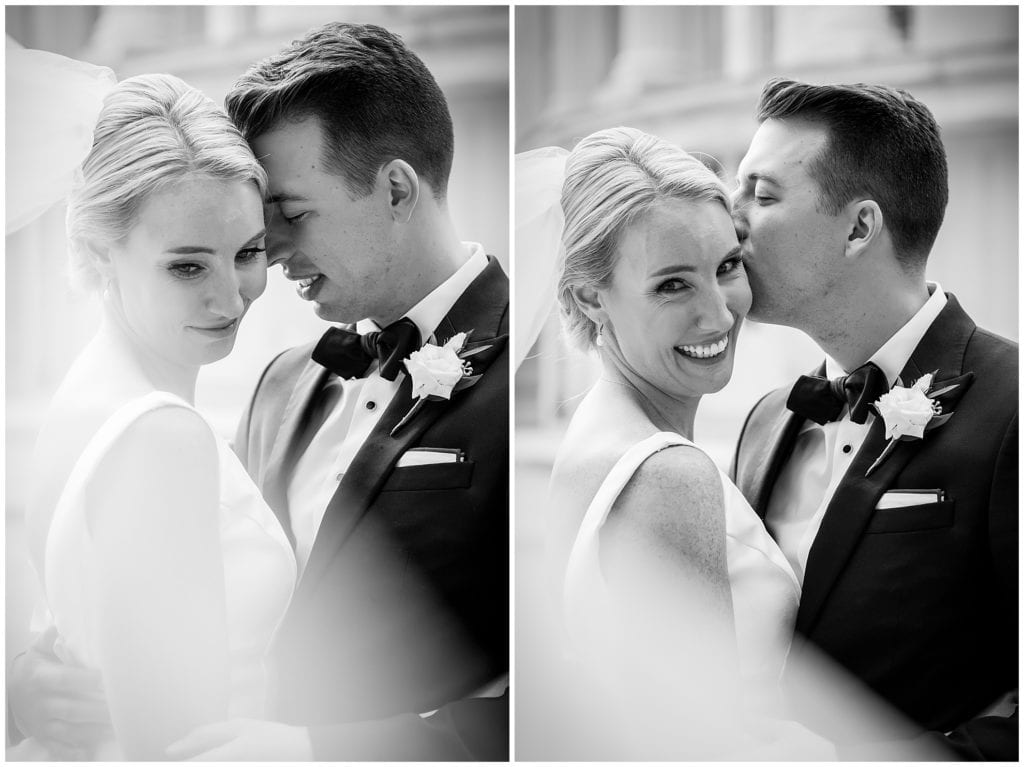 Black and white veil shots with groom kissing bride on the cheek