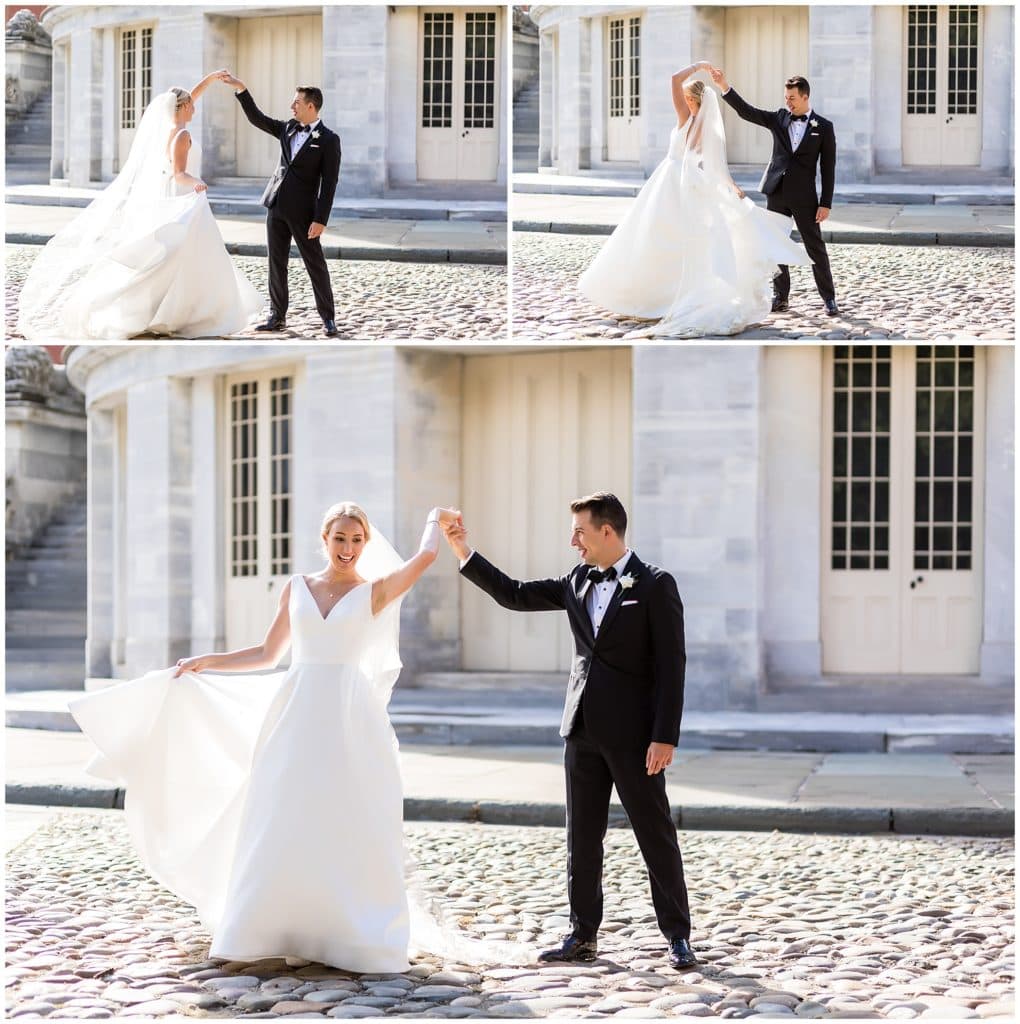 Groom spinning bride with long veil and silk ballgown at Merchant Exchange Building