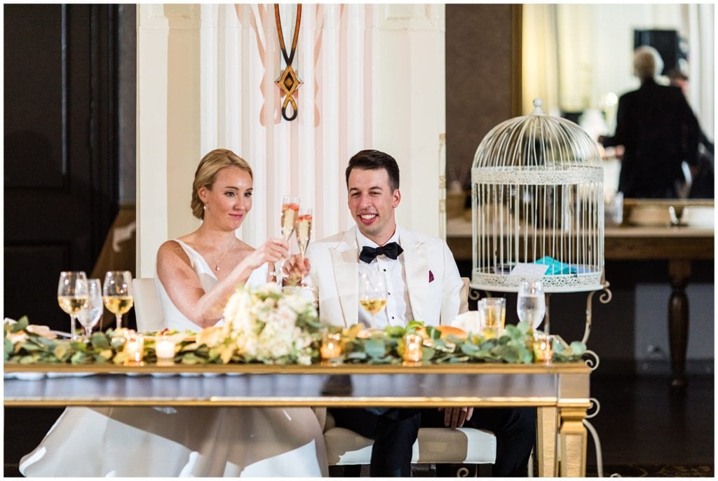 Bride and groom toasting to each other during their Ballroom at the Ben wedding reception