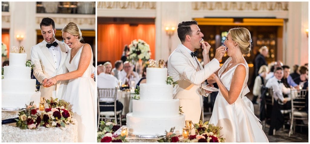 Bride and groom cut and feed each other wedding cake during reception at Ballroom at the Ben