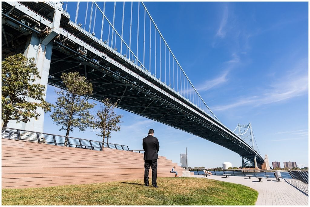 Groom waiting for his bride at first look at Race Pier in Philadelphia