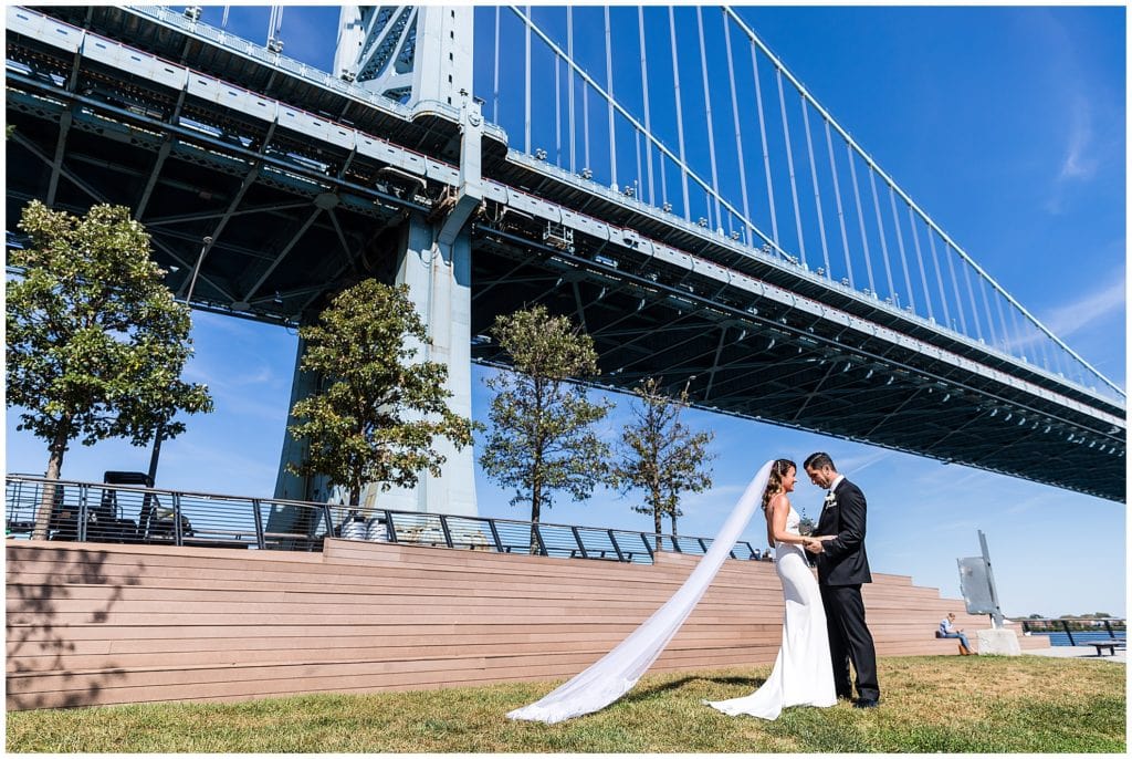 Bride and groom during first look at Race Street Pier in Philadelphia
