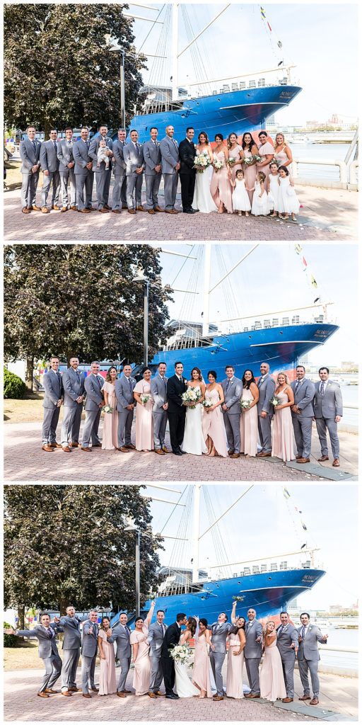 Bridal party portraits with pastel pink dresses, grey suits in front of boats on Race Street Pier