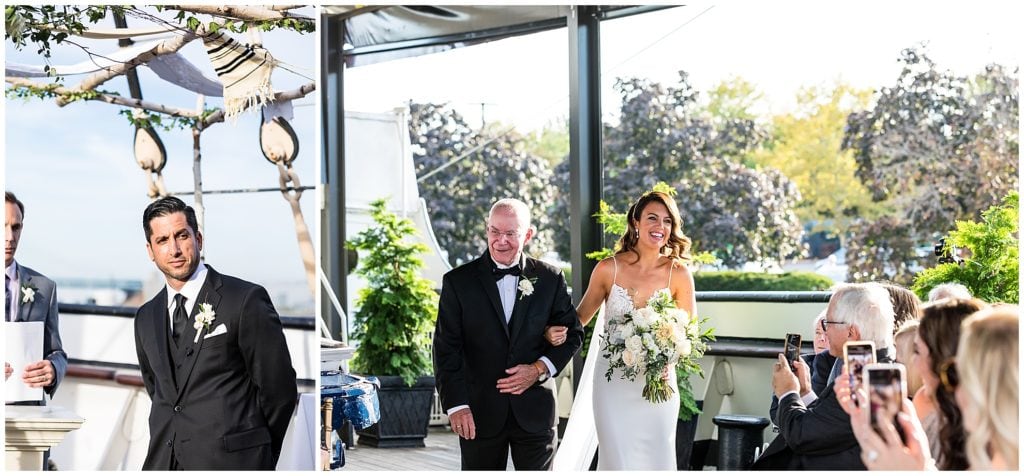 Groom watching bride and her father walk down the aisle, Moshulu boat Philadelphia wedding ceremony