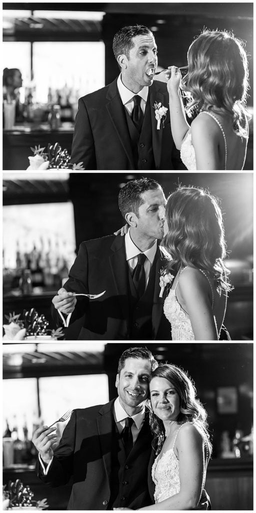 Bride and groom feeding cake to each other and kissing during cake cutting