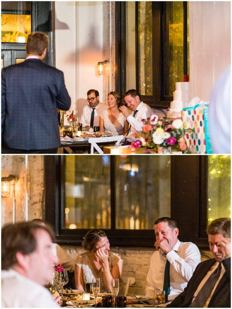 Bride and groom laughing and wiping tears during speeches and toasts at Osteria wedding reception