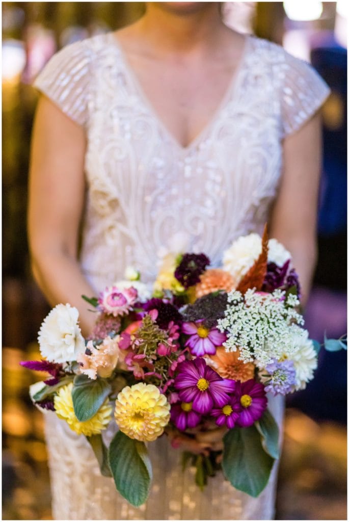Colorful bridal bouquet with yellow Dahlias and purple flowers