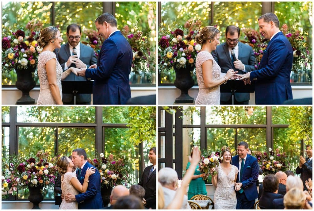 Bride and groom exchange rings and kiss during intimate Osteria wedding ceremony