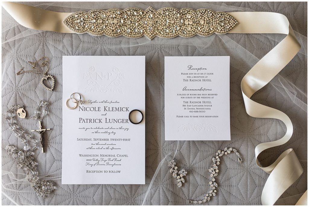 Simple wedding invitation suite with embossing, bridal jewelry and accessories, wedding bands, and rosary