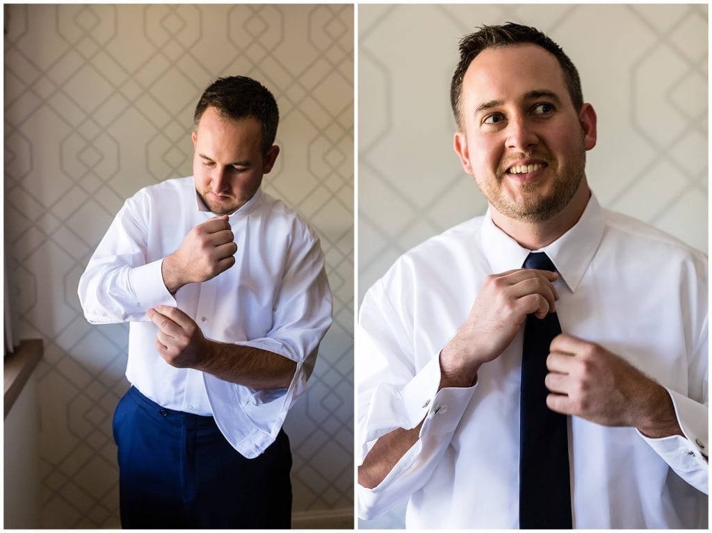 Groom getting ready, buttoning his shirt, and straightening tie