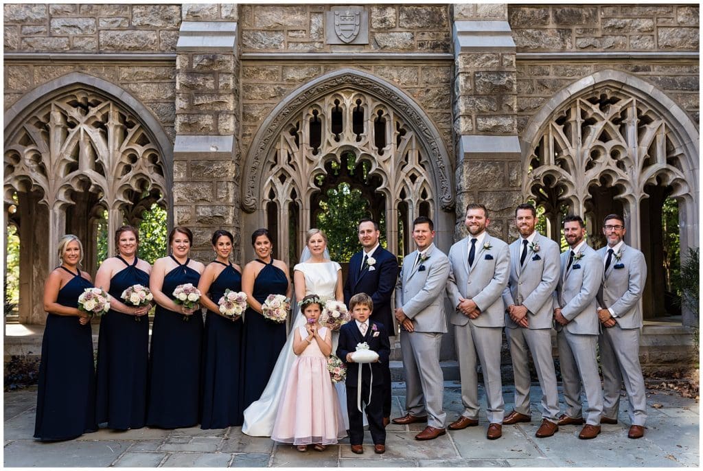 Wedding party with flower girl and ring bearer outside church in Valley Forge National Park