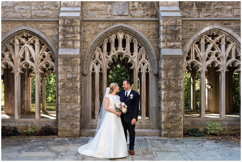 Traditional bride and groom looking at each other wedding portrait at Valley Forge National Park