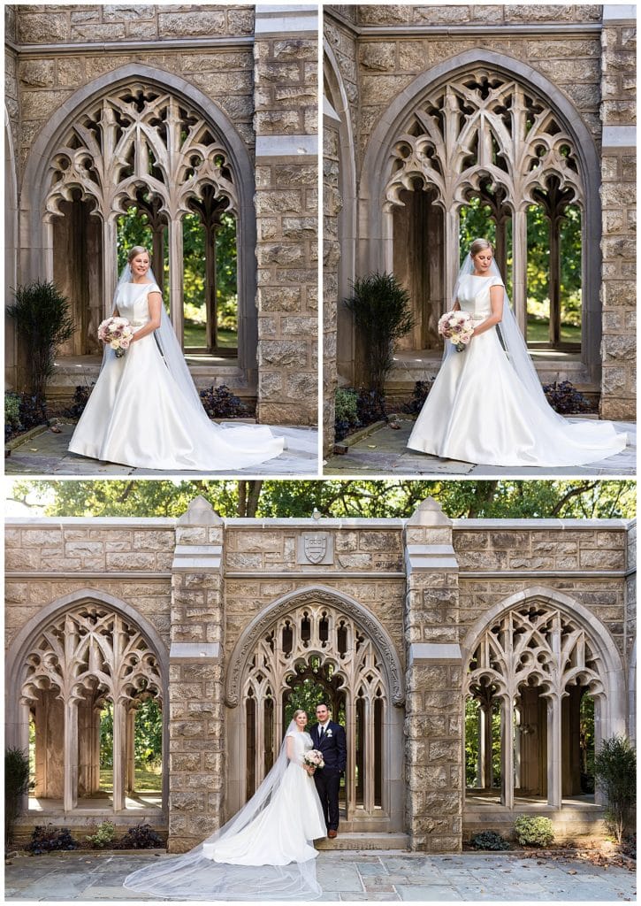 Traditional bridal portraits with long veil and dress train outside church in Valley Forge National Park