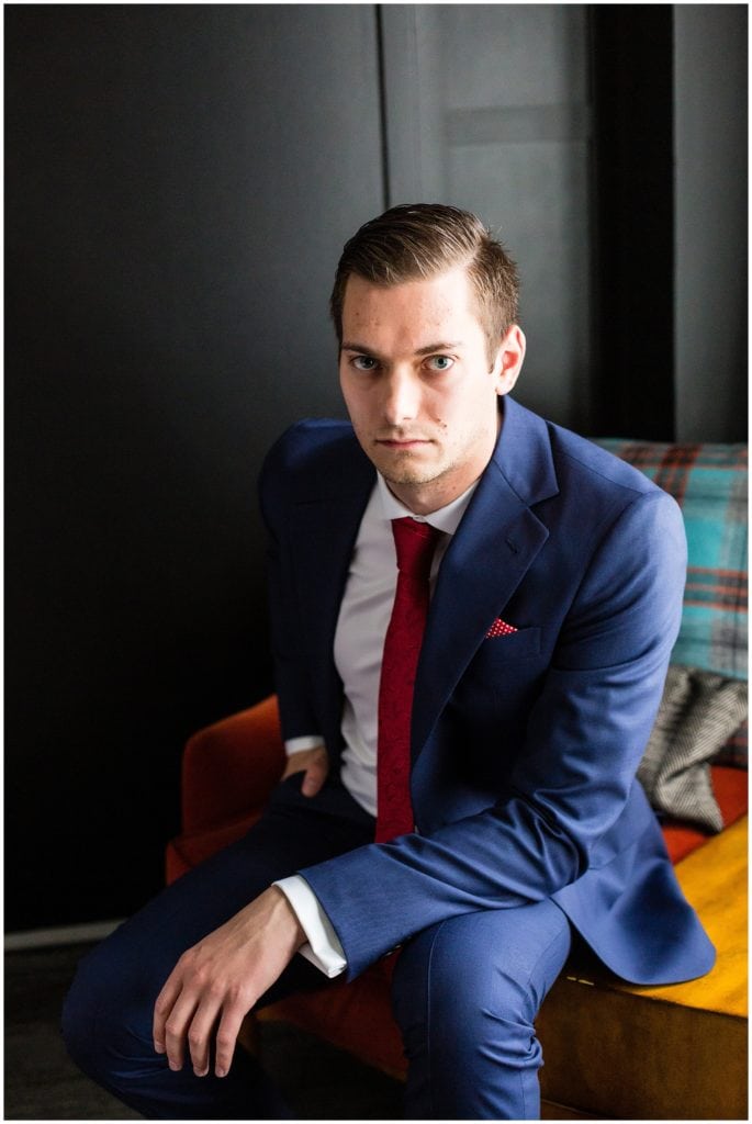 Traditional window lit groom portrait