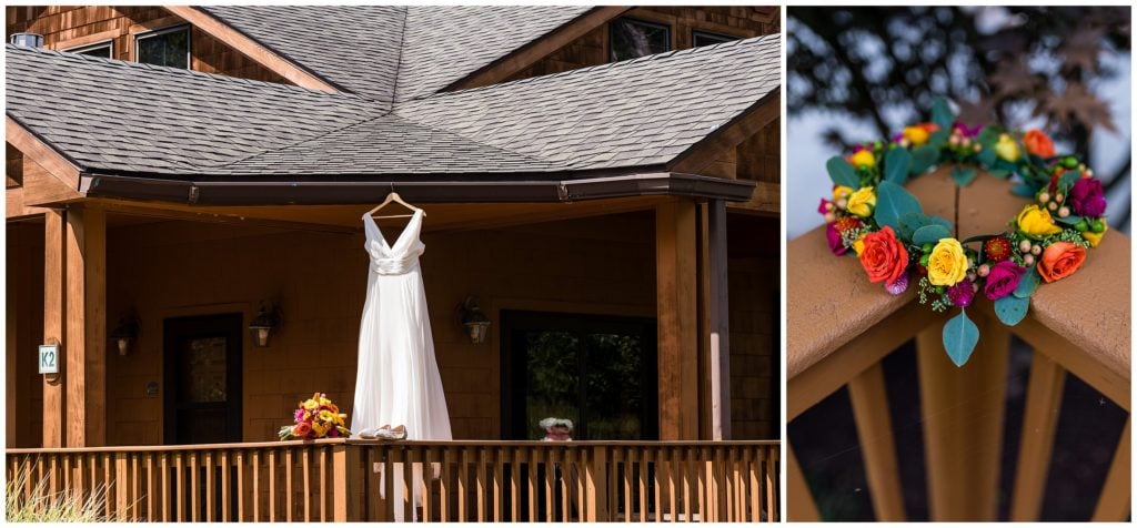 Wedding gown hanging from outdoor deck with bouquet, shoes, and flower crown