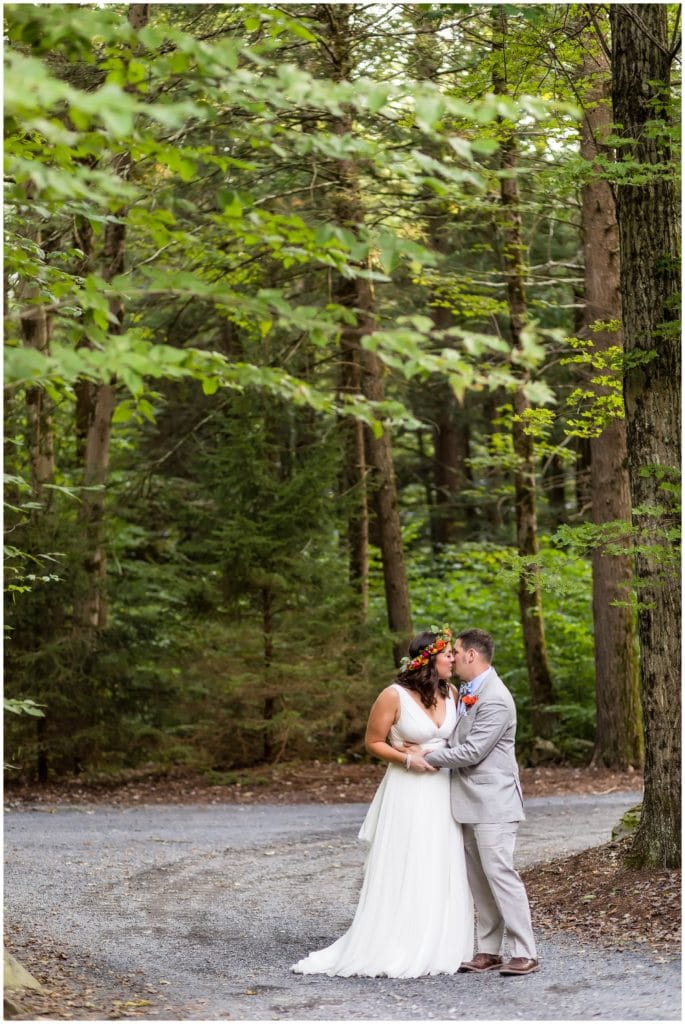 Outdoor sunset woods bride and groom wedding portrait