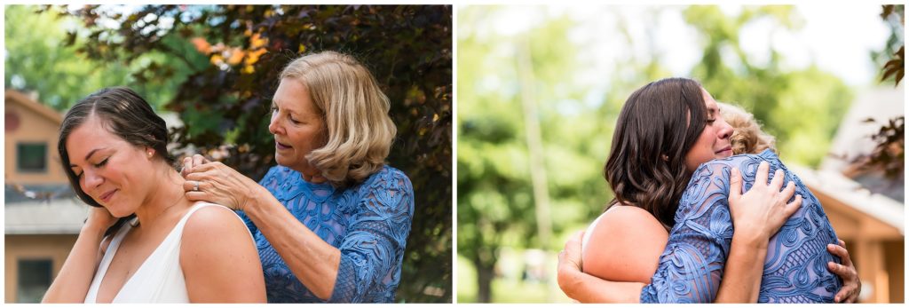 Bride crying as mother of bride helps her put on jewelry