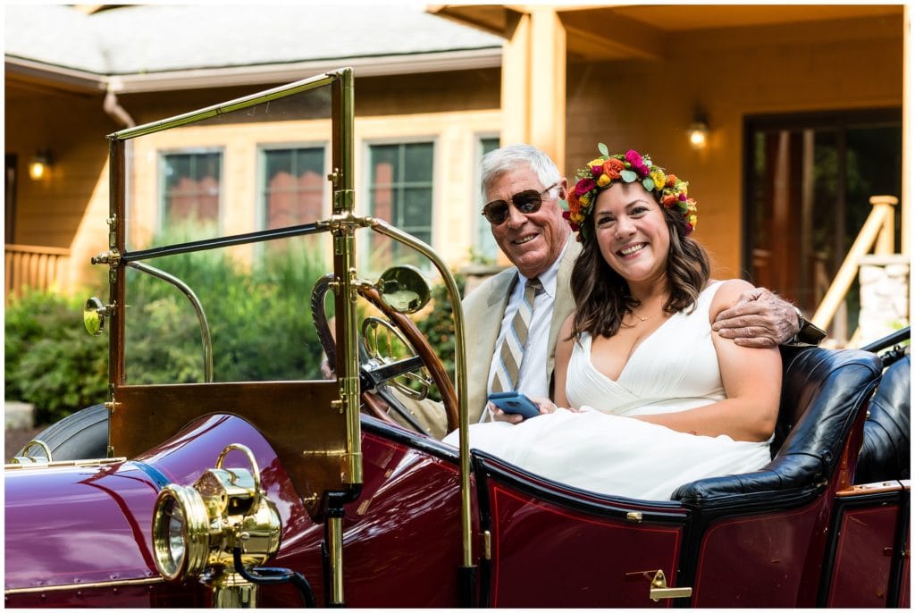 Father of the bride driving bride to wedding in old classic car