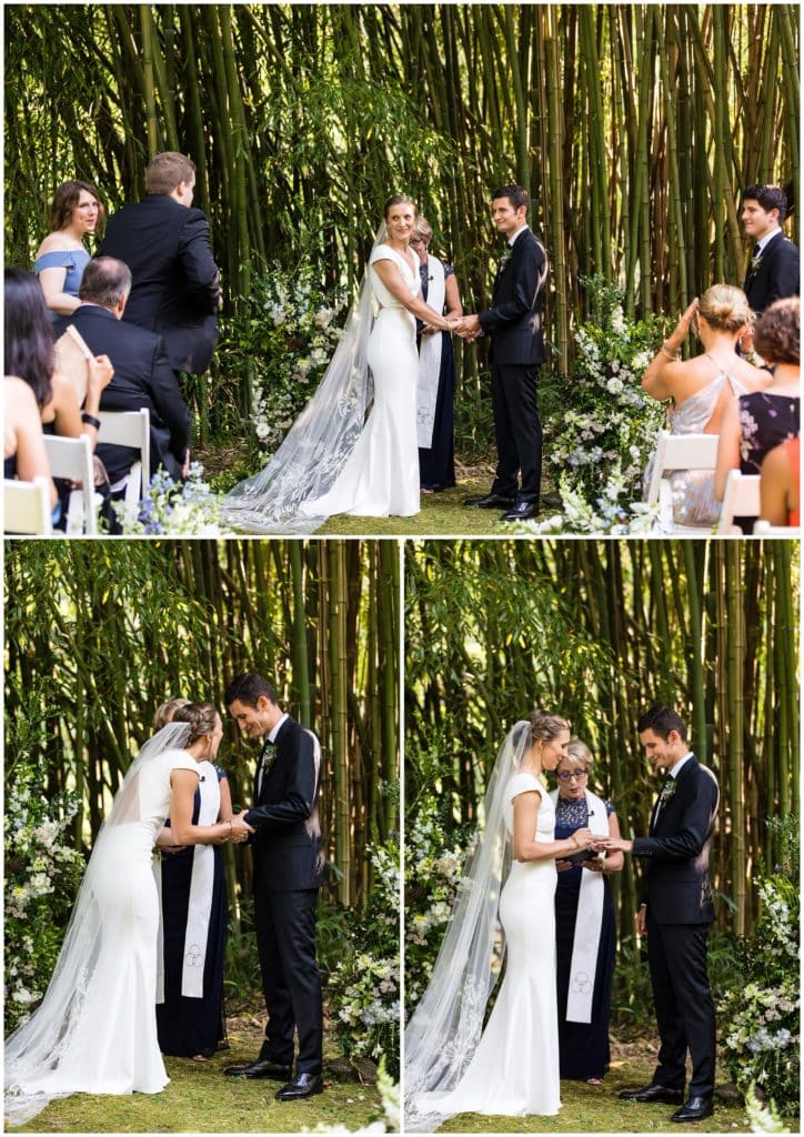 Bride and groom exchanging wedding bands during outdoor Old Mill wedding ceremony