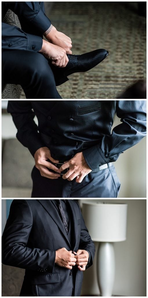 Groom getting ready for wedding putting on matching black patterned shoes and belt