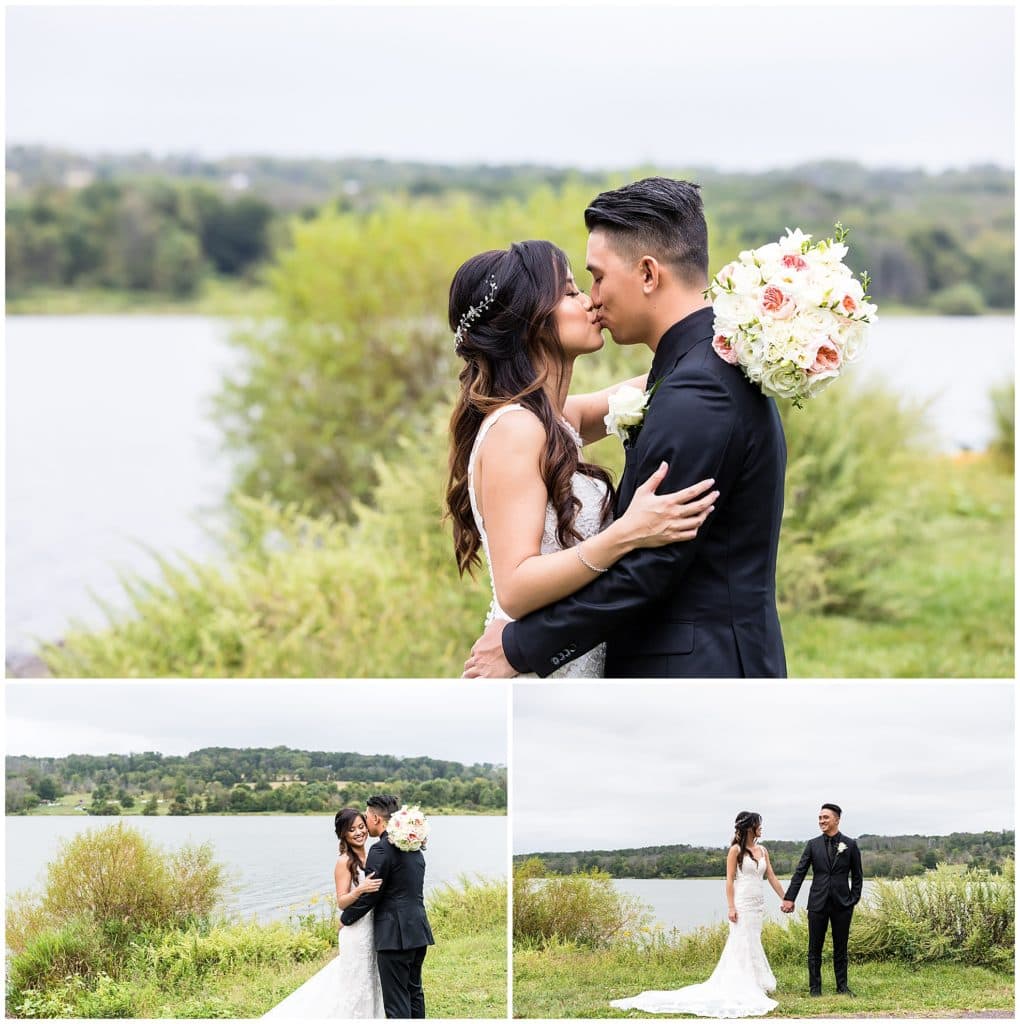 Bride and groom smile, kiss, and snuggle portraits in front of lake