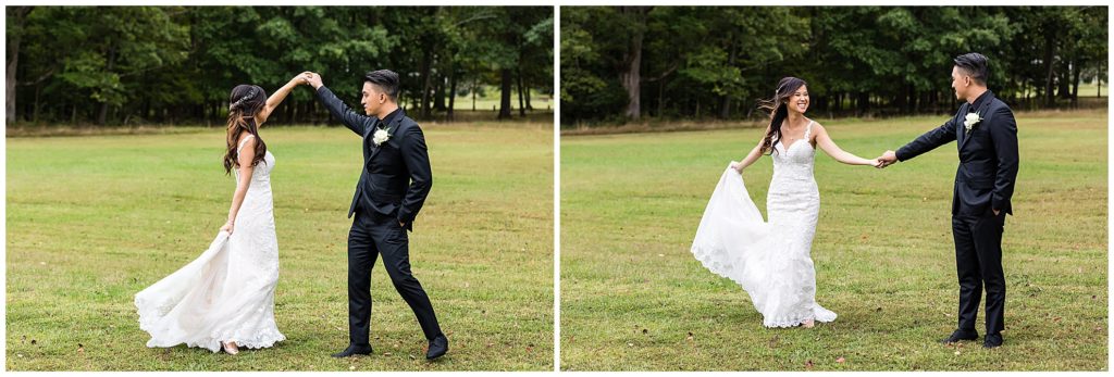 Groom spinning bride in her wedding gown in a field