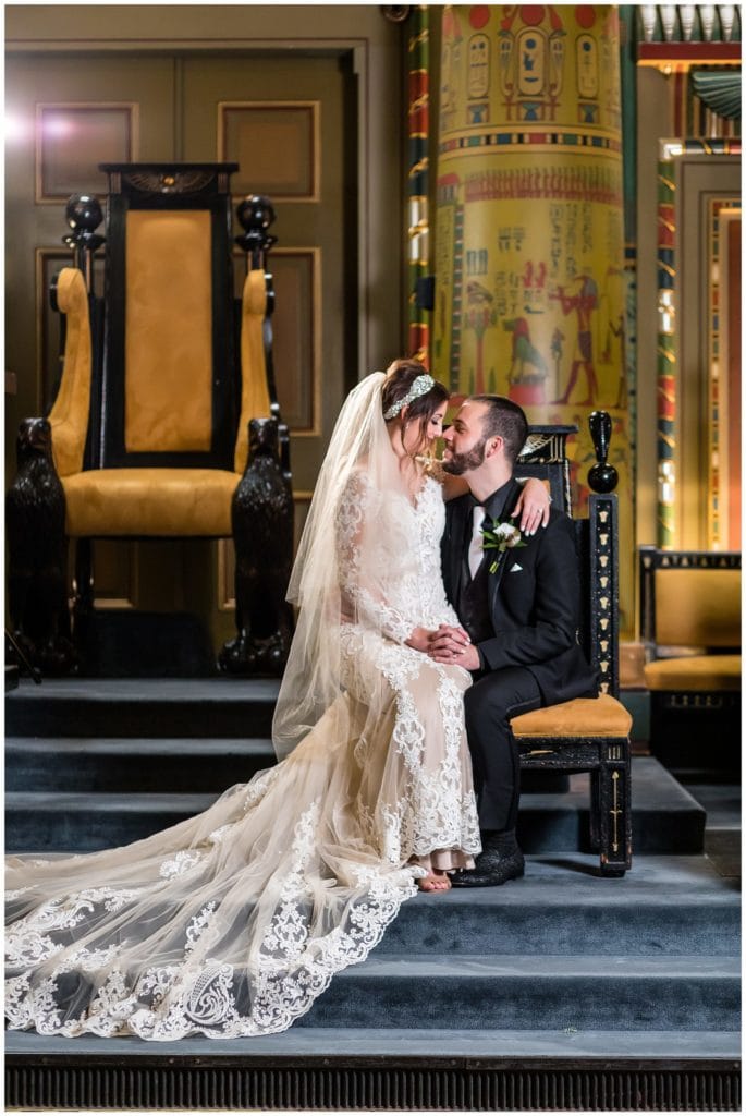 dramatic indoor portrait of bride and groom in Eqyptian room at ONE North Broad