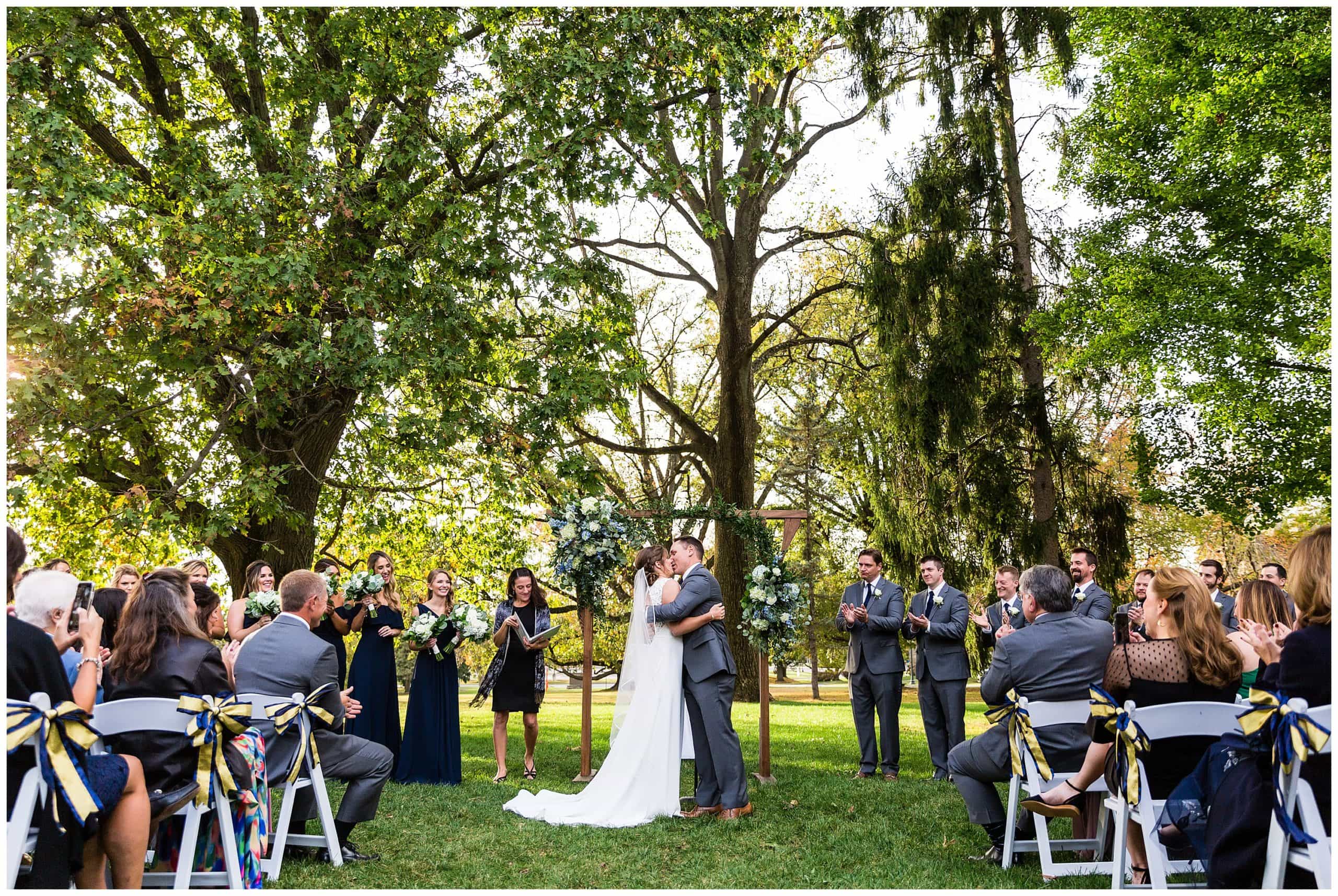 bride and groom share first married kiss