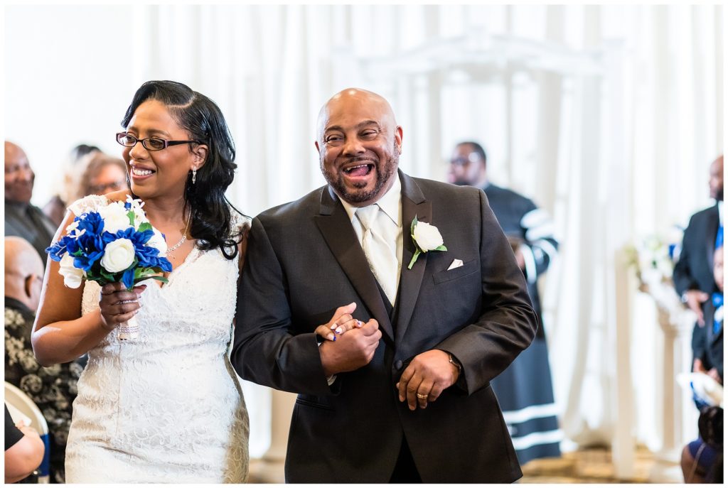 bride and groom coming back up the aisle as newlyweds