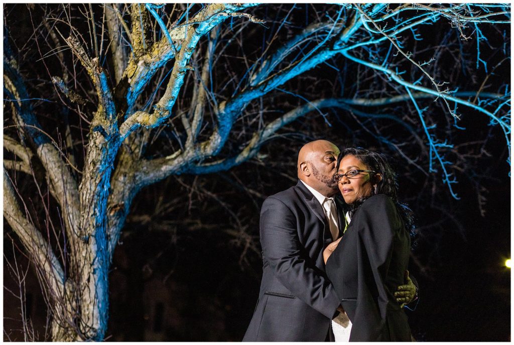 outdoor night time portrait with blue light on tree